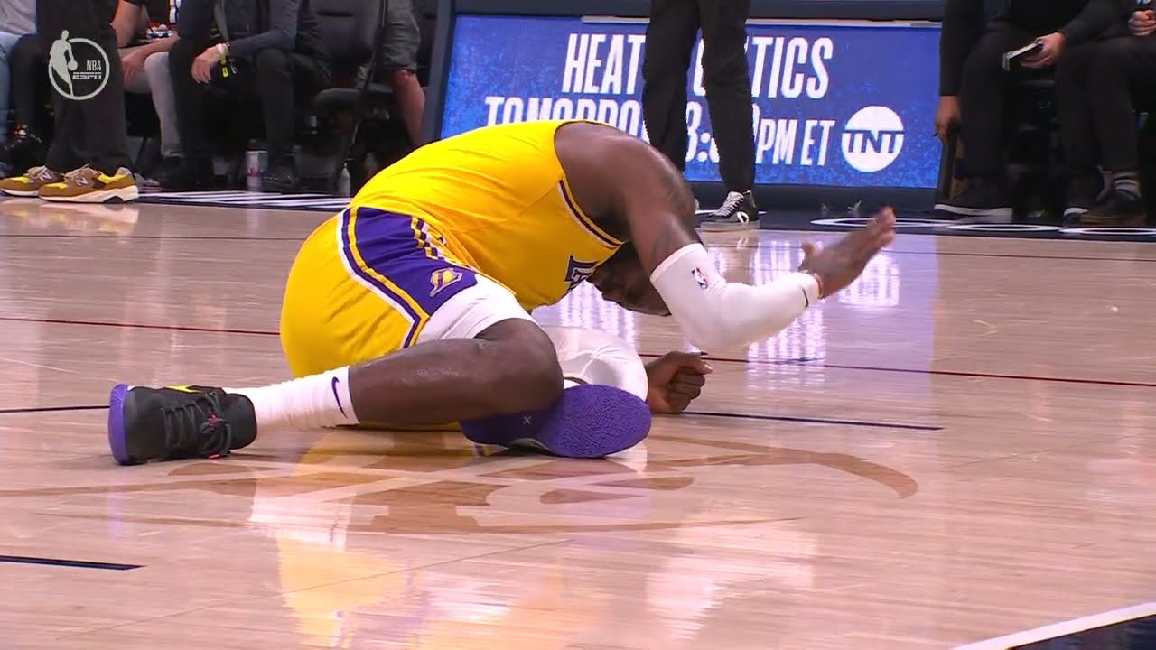Austin Reaves DRILLS the trey as LeBron James goes down in pain | NBA on ESPN