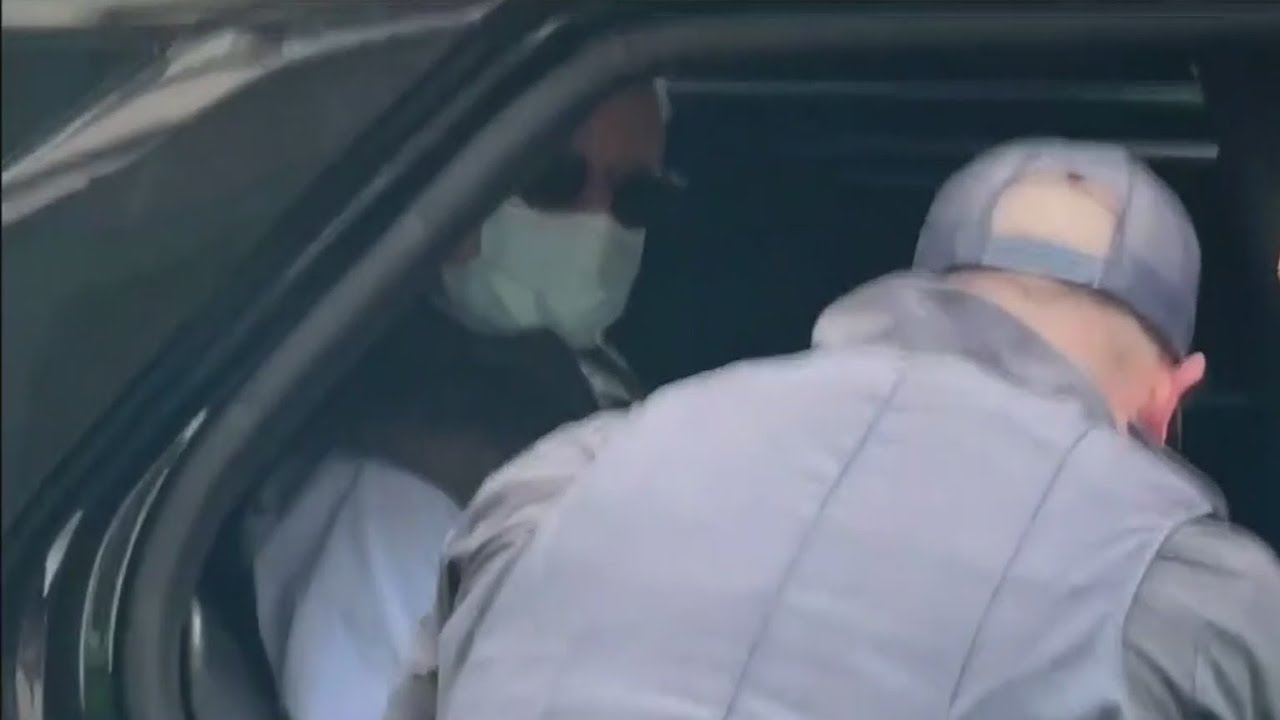 Gallery owner Collier Gwin in San Francisco police custody for spraying homeless woman with hose