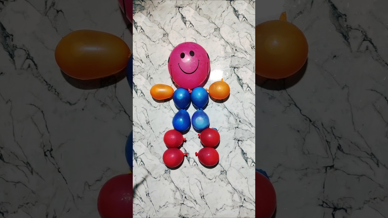 A beautiful smiling ☺️baby made from water balloons #colors #balloon #trend #rainbow #apnatv #water